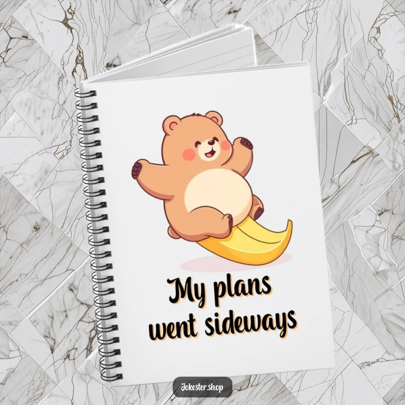 Funny bear banana slip notebook with a cover depicting a plump bear's comical struggle on a slippery banana peel.