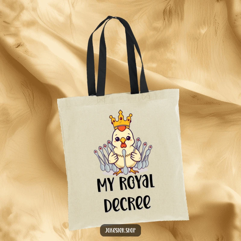 A funny rubber chicken wearing a tiny crown, commanding a vast army of spoons on a practical tote bag.