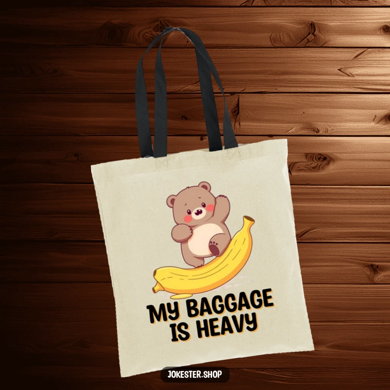 Funny tote bag featuring a plump bear comically trying to climb a slippery banana peel, a whimsical nature accessory.